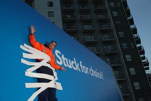 Man stuck to billboard